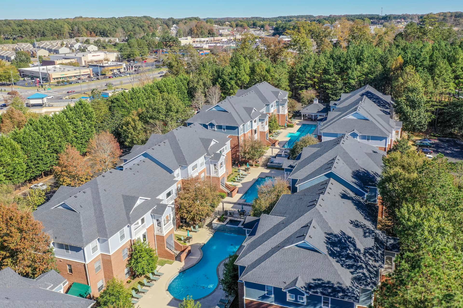 aerial view of Halston Riverside apartment complex with pools