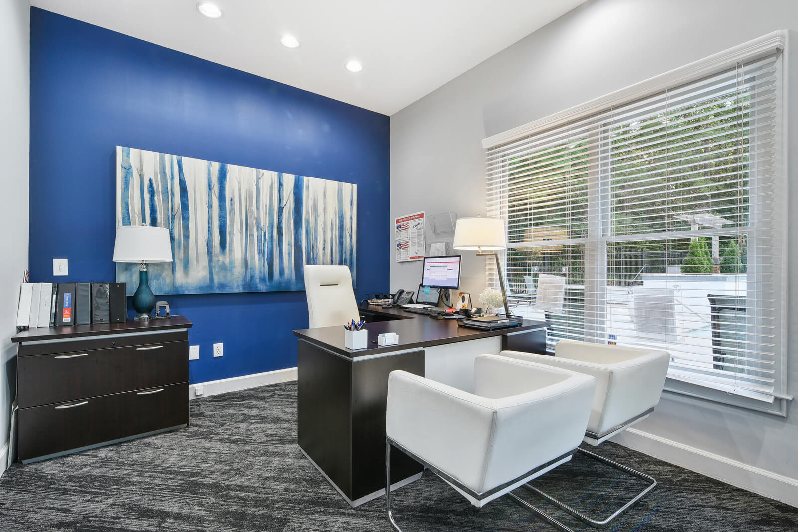 leasing office with modern furniture and art